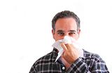 Man with cold blowing nose