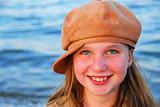 Smiling girl in a hat