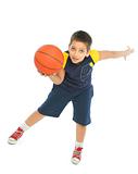 Boy playing basketball isolated