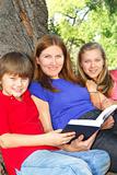 Family reading a book
