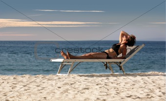 Woman relaxing on a beach