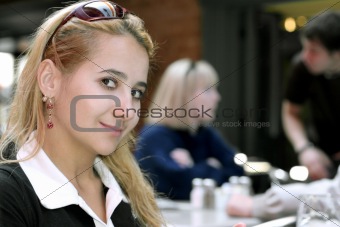 Beautiful girl sitting in a restaurant