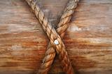 Rope, nail and wooden surface