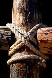 Rope, nail and wooden surface