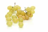 Cluster of green tasty grapes on a white background