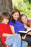 Family reading a book