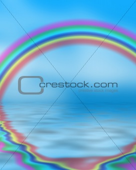 Rainbow reflected in blue ocean