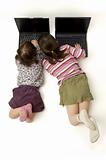 two little girls working with a laptop