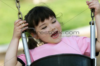 Cute girl swinging