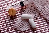 Gauze pills and syringe