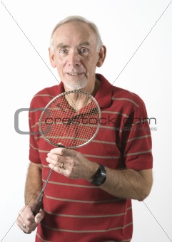 Healthy senior man ready to play badminton