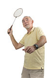 Elderly man playing badminton