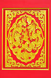 golden dragon decorated on red wood