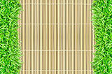 grass frame on bamboo background 