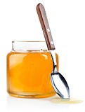 sweet honey in glass jars with spoon