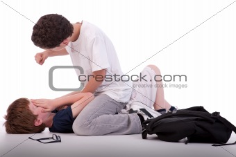 child crying on the floor child being beaten by a teenager, isolated on white, studio shot
