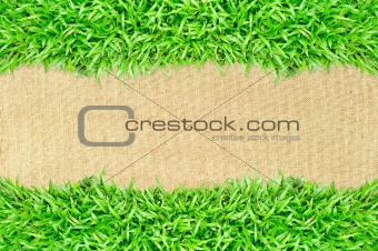 grass frame on burlap texture background