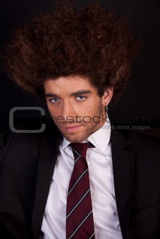 Portrait of a handsome and young  business man isolated on black background. Studio shot.