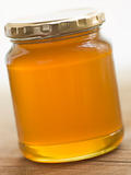 Jar Of Honey And Spoon