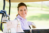 Portrait Of Woman Sitting In A Golf Cart