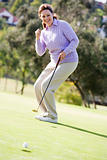 Woman Playing A Game Of Golf