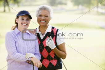 Female Friends Enjoying A Game Of Golf