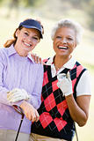 Portrait Of Two Female Golfers