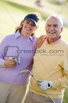 Couple Enjoying A Game Of Golf