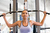 Woman Weight Training At Gym