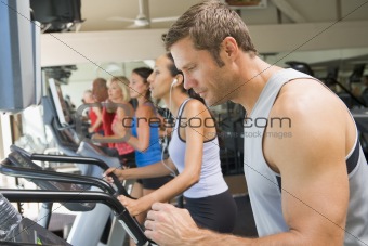 Man Running On Treadmill At Gym