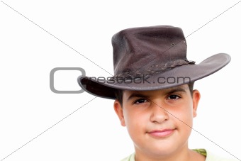 Young cowboy smiling, looking at camera