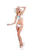 posing blonde girl in bikini and white summer hat