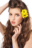 fresh girl with yellow flower in hair