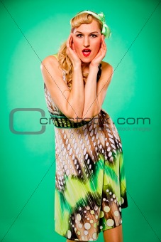Surprised beautiful sensual woman holding hands near head. Pin-up and retro style.

