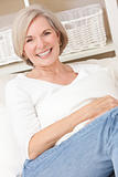 Portrait of Attractive Senior Woman Relaxing At Home