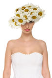 beautiful woman in hat of daisies and white dress