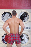 Muscular Man In Laundromat