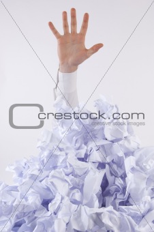 Businessman overwhelmed by paper