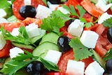 Greek salad with olives, tomatoes and feta cheese