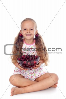 Girl holding a bowl of ripe cherries