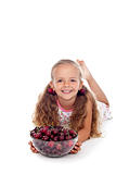 Happy girl with summer fruits - cherries in a bowl