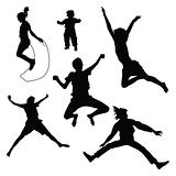 silhouettes of kids jumping