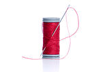 Red thread bobbin and needle 