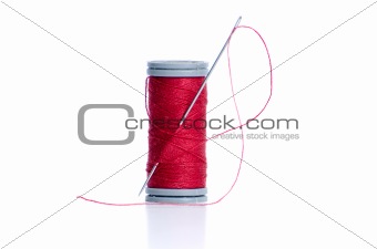Red thread bobbin and needle 