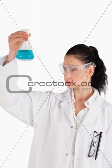 Dark-haired woman conducting an experiment