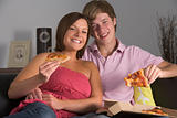 Teenage Couple Enjoying Pizza