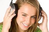 Teenage Girl Listening To Music On Headphones