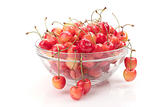 ripe cherry in bowl isolated on white