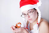 Santa girl with a toy