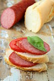 Sandwiches with baguette and salami with cheese and tomatoes